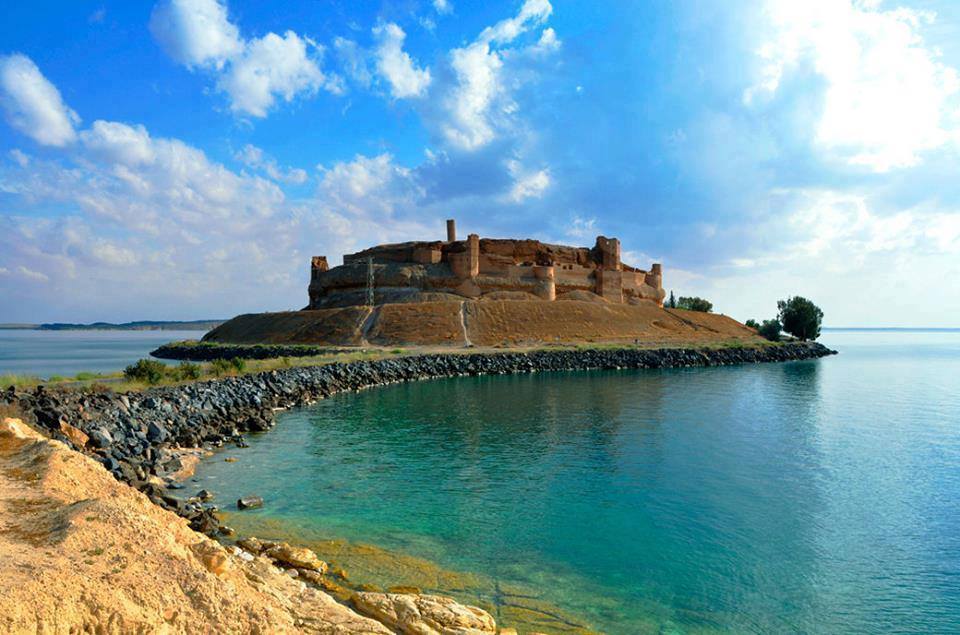 The Euphrates River in Raqqa with the historic Ja'bar Castle on its shoreline
